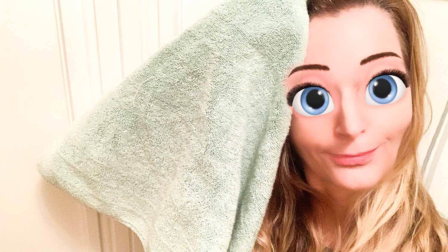 Woman with towel and bulging eyes