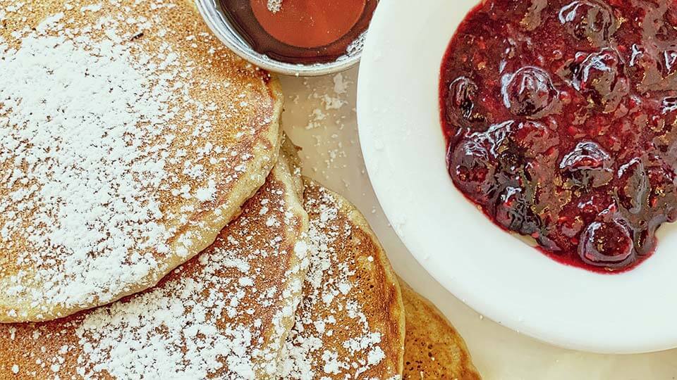 Plate with panckes and fruit topping