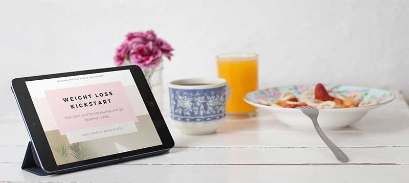 Weight Loss Kick Start course displayed on tablet with a healthy breakfast in the background